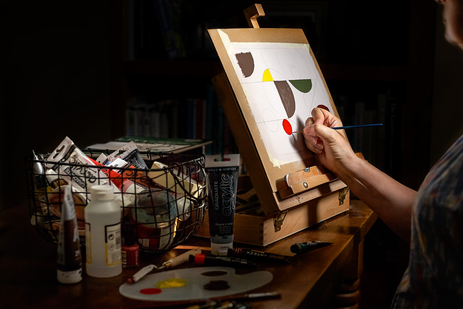Mondrian's apprentice painting as a hobby.